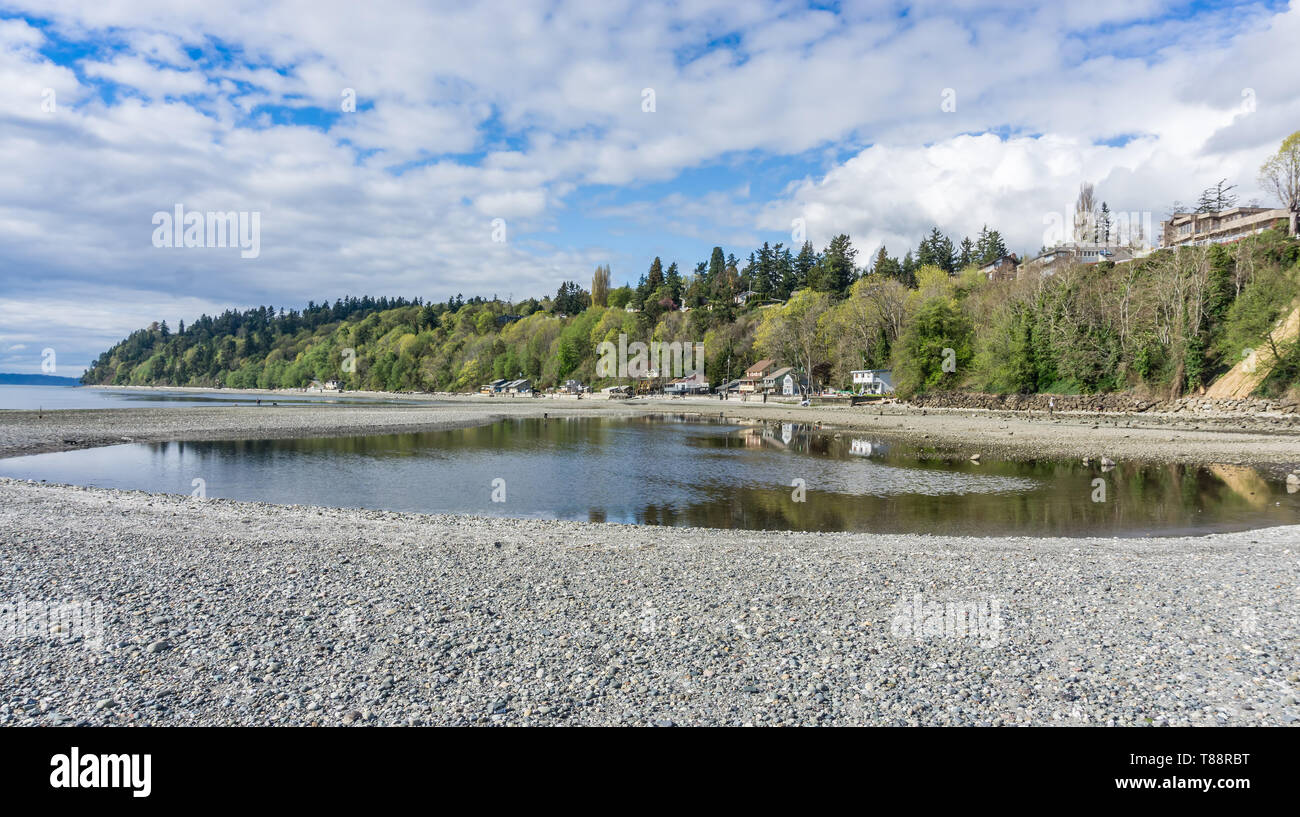 A low tide creates a tide pool in front of the shoreline in Des Moines