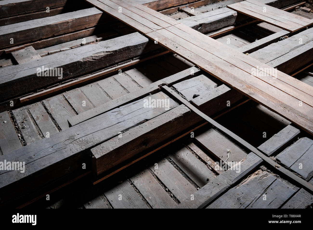 old wooden floor beam and plank construction in attic loft Stock Photo