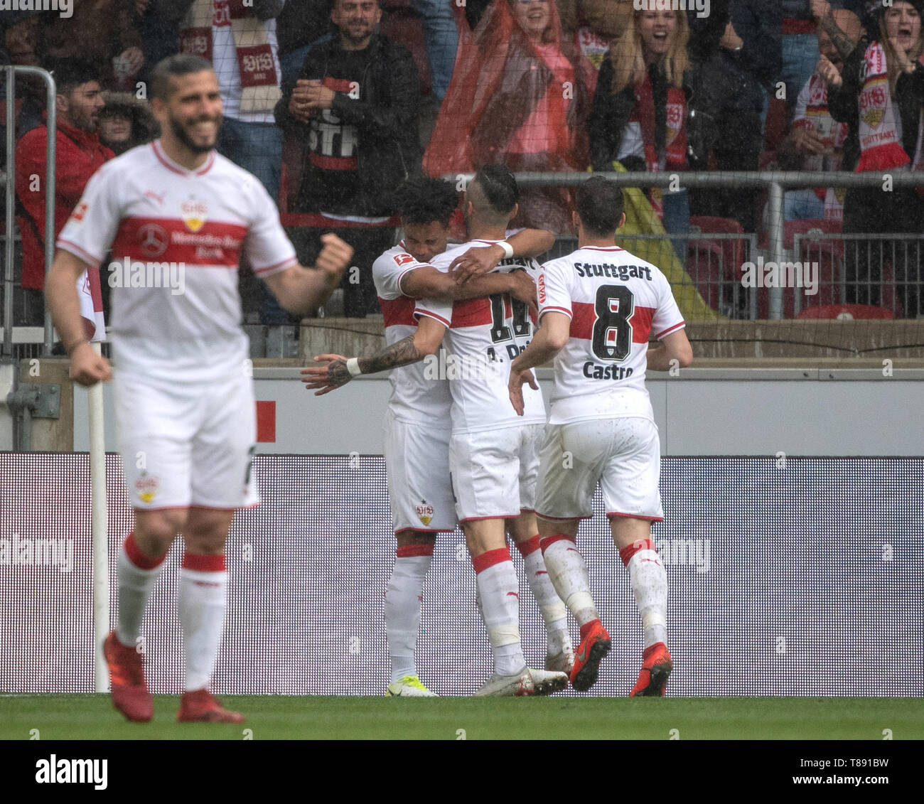 Stuttgart, Germany. 11th May, 2019. Soccer: Bundesliga, VfB Stuttgart - VfL Wolfsburg, 33rd matchday: Stuttgart's Emiliano Insua (l-r) Daniel Didavi, Anastasios Donis and Gonzalo Castro cheer after the goal to 2-0. Credit: Fabian Sommer/dpa - IMPORTANT NOTE: In accordance with the requirements of the DFL Deutsche Fußball Liga or the DFB Deutscher Fußball-Bund, it is prohibited to use or have used photographs taken in the stadium and/or the match in the form of sequence images and/or video-like photo sequences./dpa/Alamy Live News Stock Photo