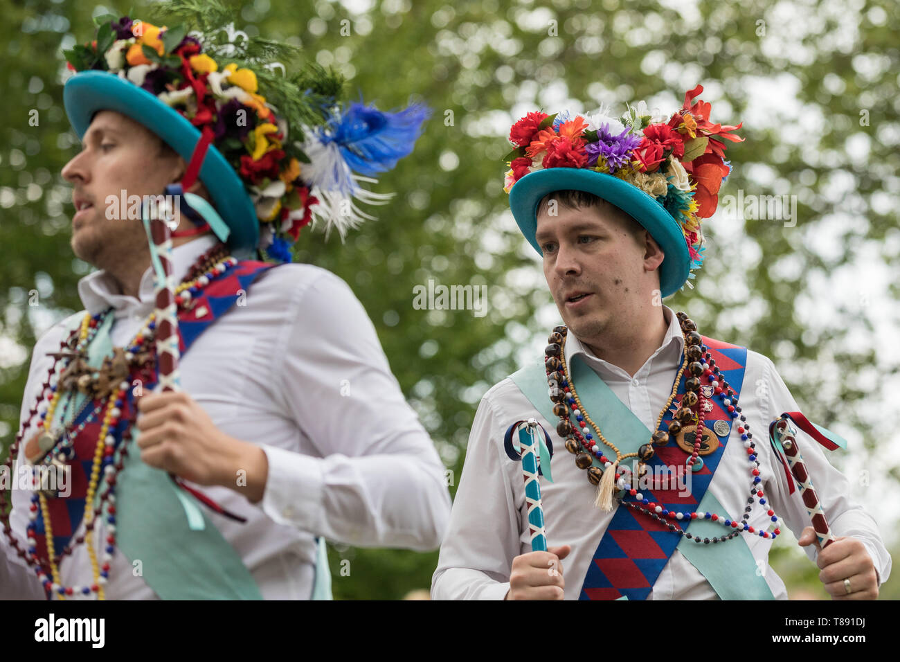 London, UK. 11th May 2019. Westminster Day of Dance in Victoria Tower Gardens. Morris dancers from Earlsdon Morris Coventry perform a merry bells and batons traditional North West clog dance - which has its origins in the 19th century industrial towns of Lancashire and north Cheshire. Credit: Guy Corbishley/Alamy Live News Stock Photo