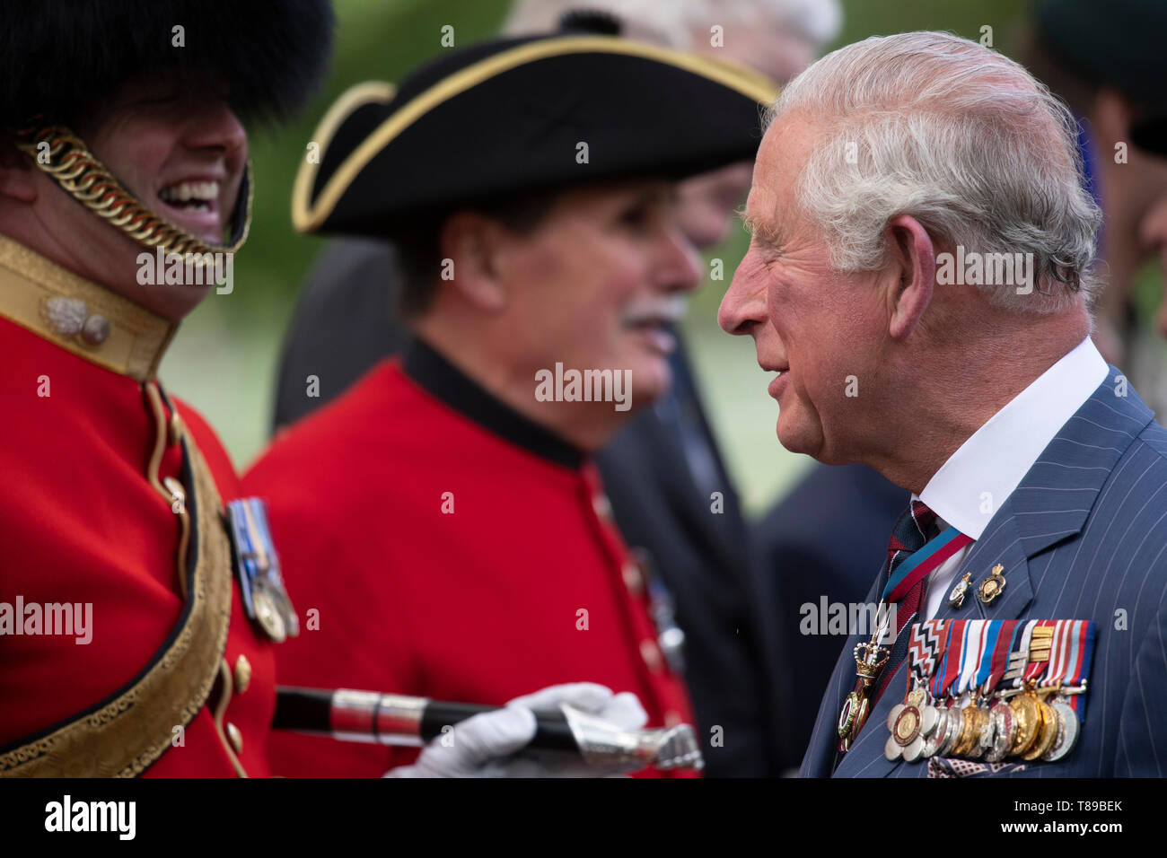 Hyde Park London, UK. 12th May 2019. HRH The Prince of Wales, Field Marshal, Colonel in Chief 1st The Queen’s Dragoon Guards, chats with members of the services and their families after The Combined Cavalry Old Comrades Association 95th annual parade and service. Credit: Malcolm Park/Alamy Live News. Stock Photo