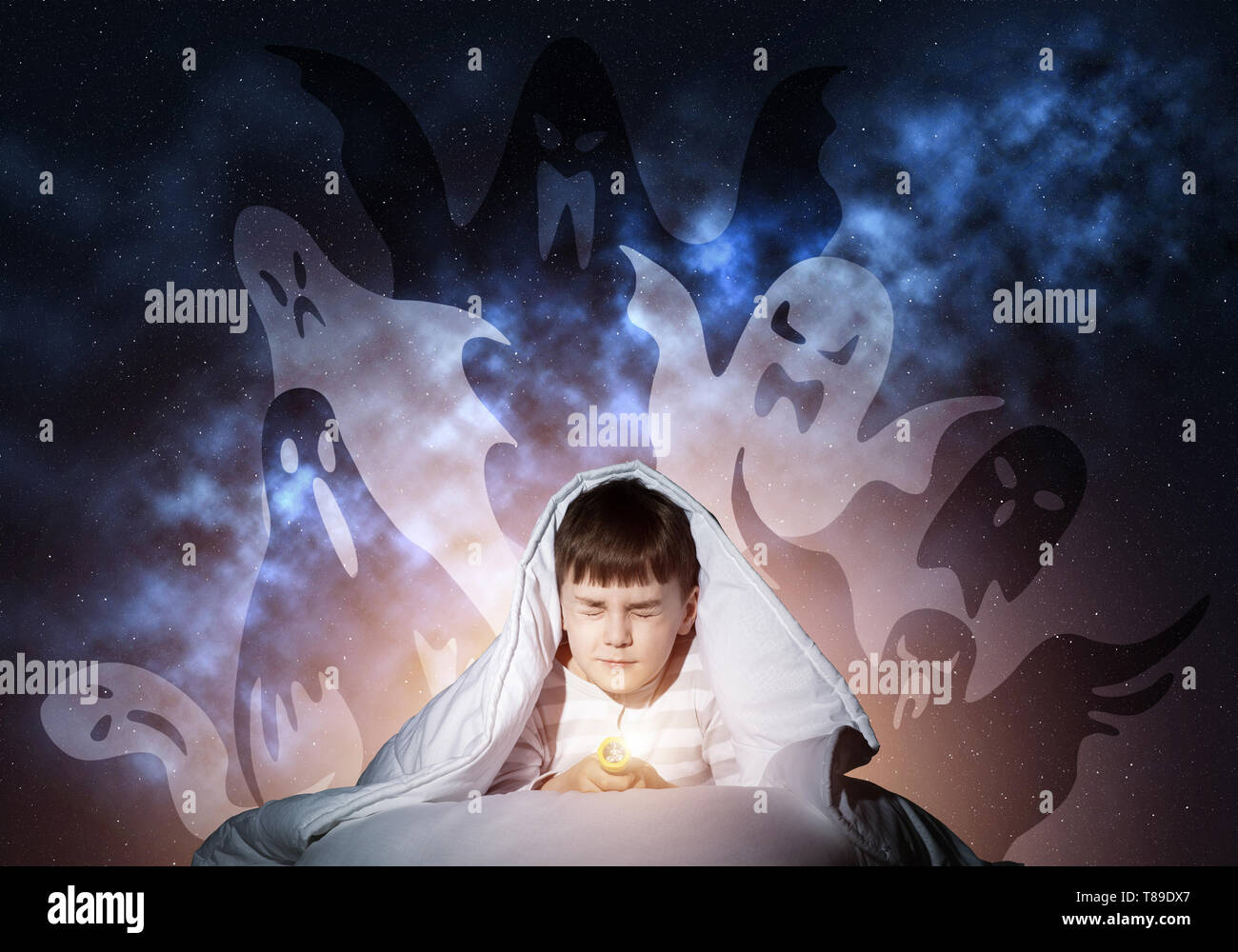 Young boy hiding under blanket Stock Photo Alamy