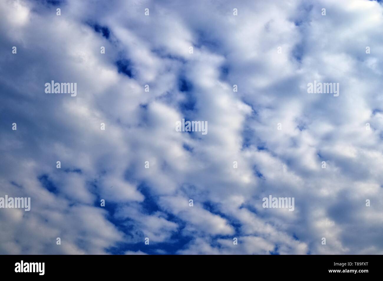 Beautiful white cloud formations in a deep blue sky on a sunny day ...