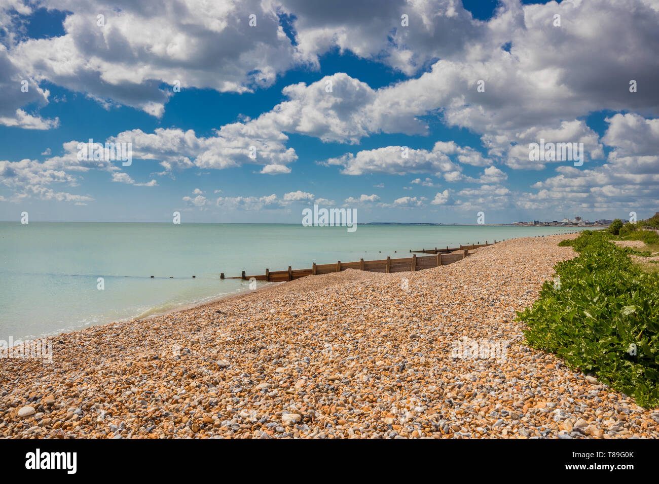 Seaside scene looking towards Butlins holiday resort on a sunny day in