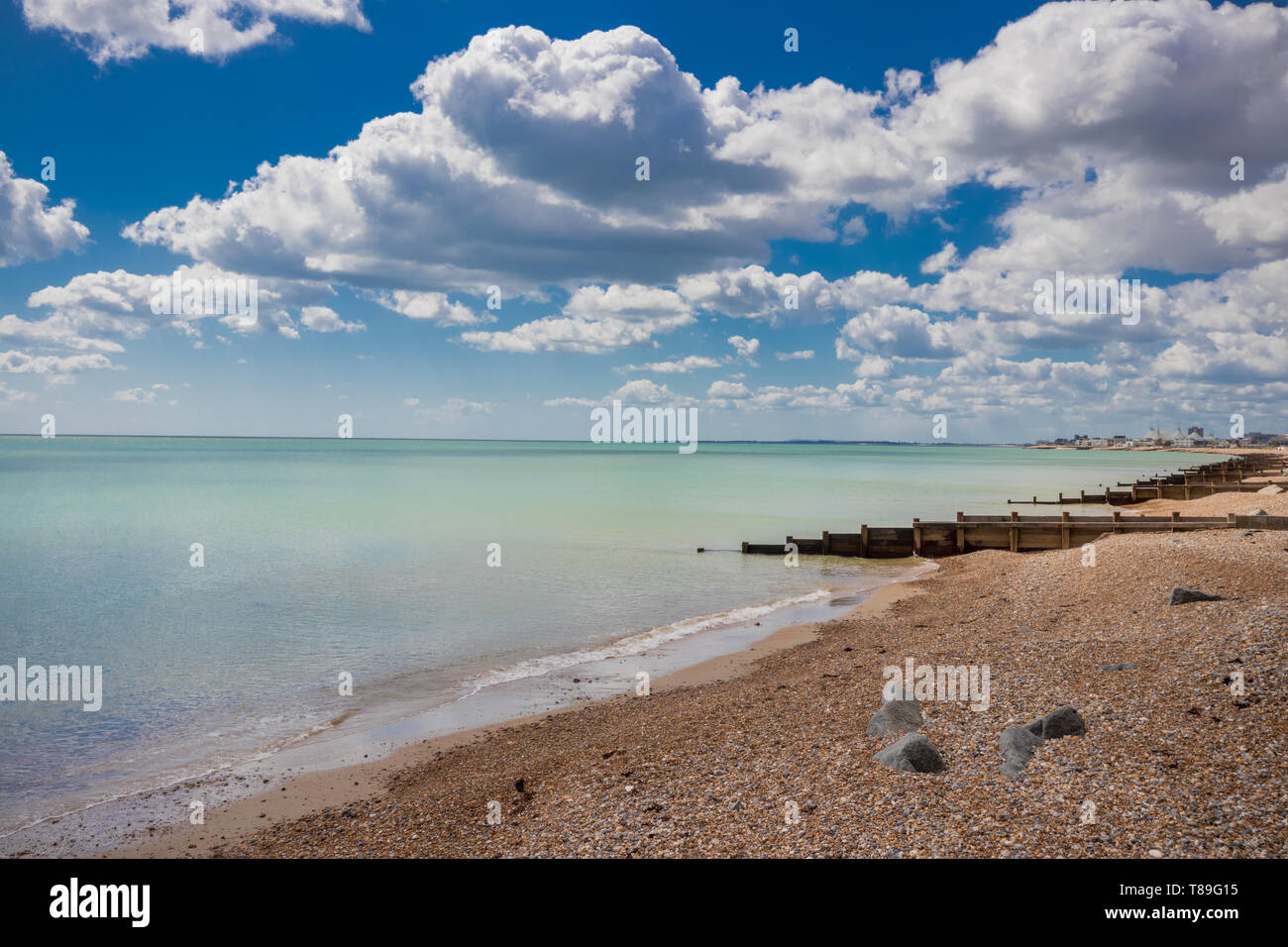 Seaside scene looking towards Butlins holiday resort on a sunny day in
