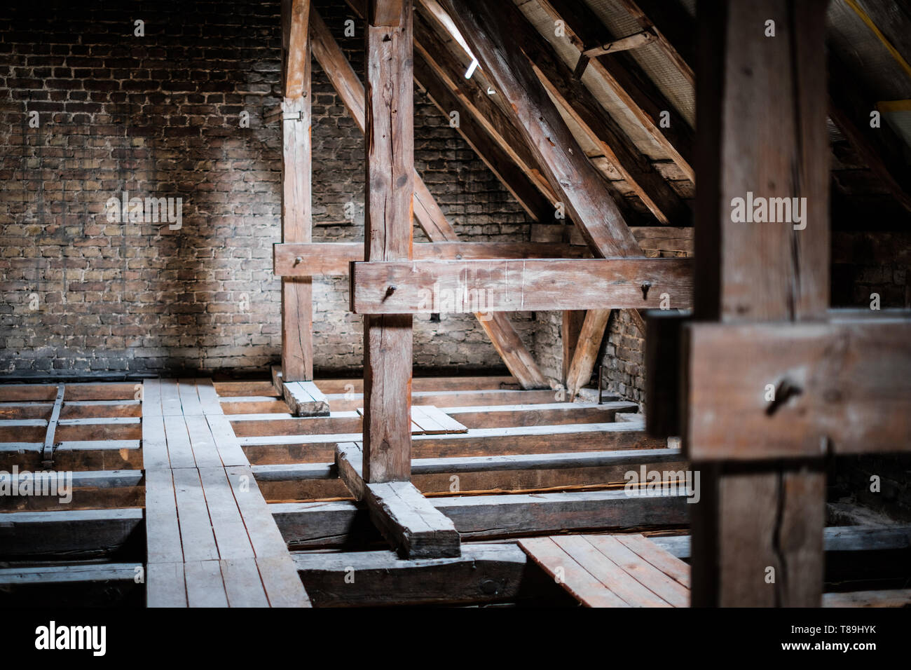 roof beams in old, empty attic / loft before renovation / construction concept - Stock Photo