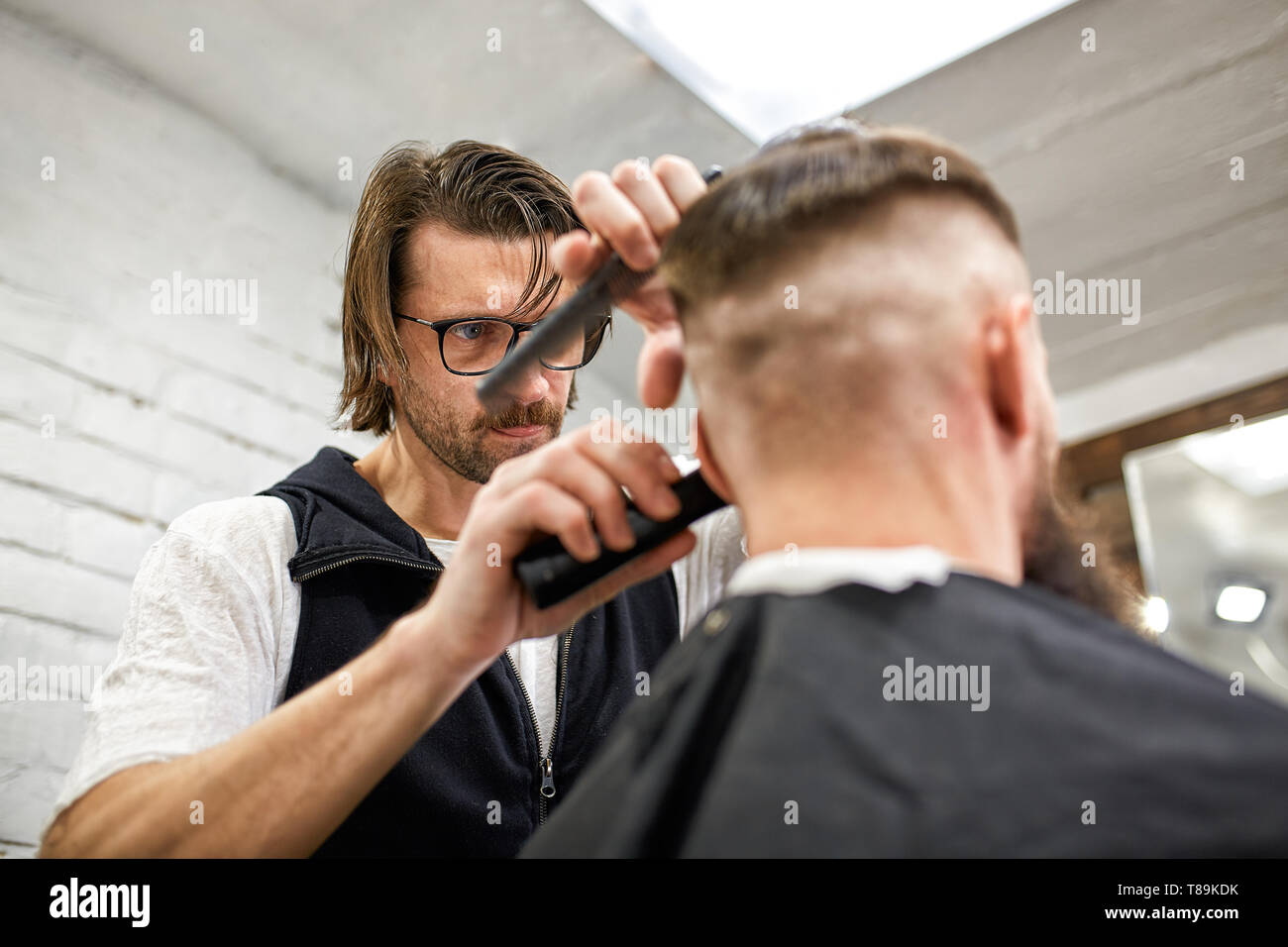 Master Barber Does Hairstyle And Styling Concept Barbershop