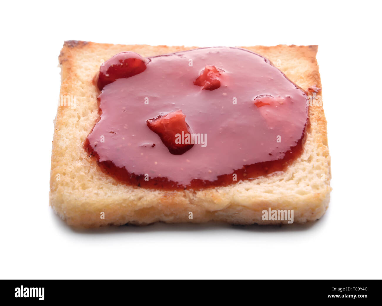 Toast with tasty strawberry jam on white background Stock Photo - Alamy