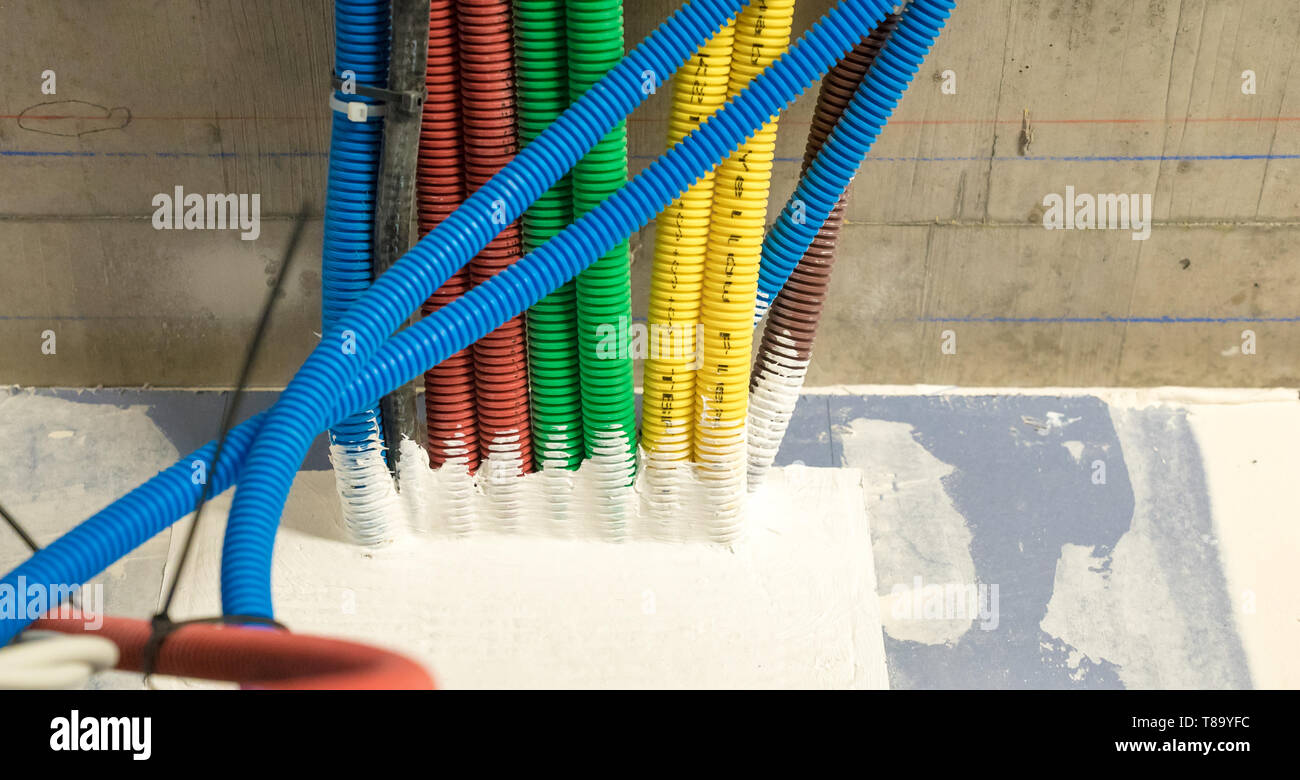 colorful plastic tubes for electrical wires in the sub ceiling in a