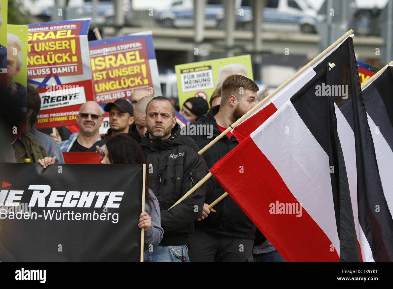 Pforzheim, Germany. 11th May 2019. The right-wing protesters march with banners, posters and flags of the German Empire through the city centre. Around 80 people participated in a march through Pforzheim, organised by the right-wing party ‘Die Rechte’ (The Right). The main issues of the march was the promotion of voting for Die Rechte’ in the upcoming European Election and their anti-immigration policies. They were confronted by several hundred counter-protesters from different political organisations. Stock Photo