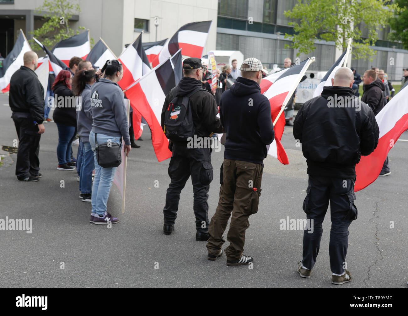 Pforzheim, Germany. 11th May 2019. The right-wing protesters hold flags of the German Empire during a rally. Around 80 people participated in a march through Pforzheim, organised by the right-wing party ‘Die Rechte’ (The Right). The main issues of the march was the promotion of voting for Die Rechte’ in the upcoming European Election and their anti-immigration policies. They were confronted by several hundred counter-protesters from different political organisations. Stock Photo