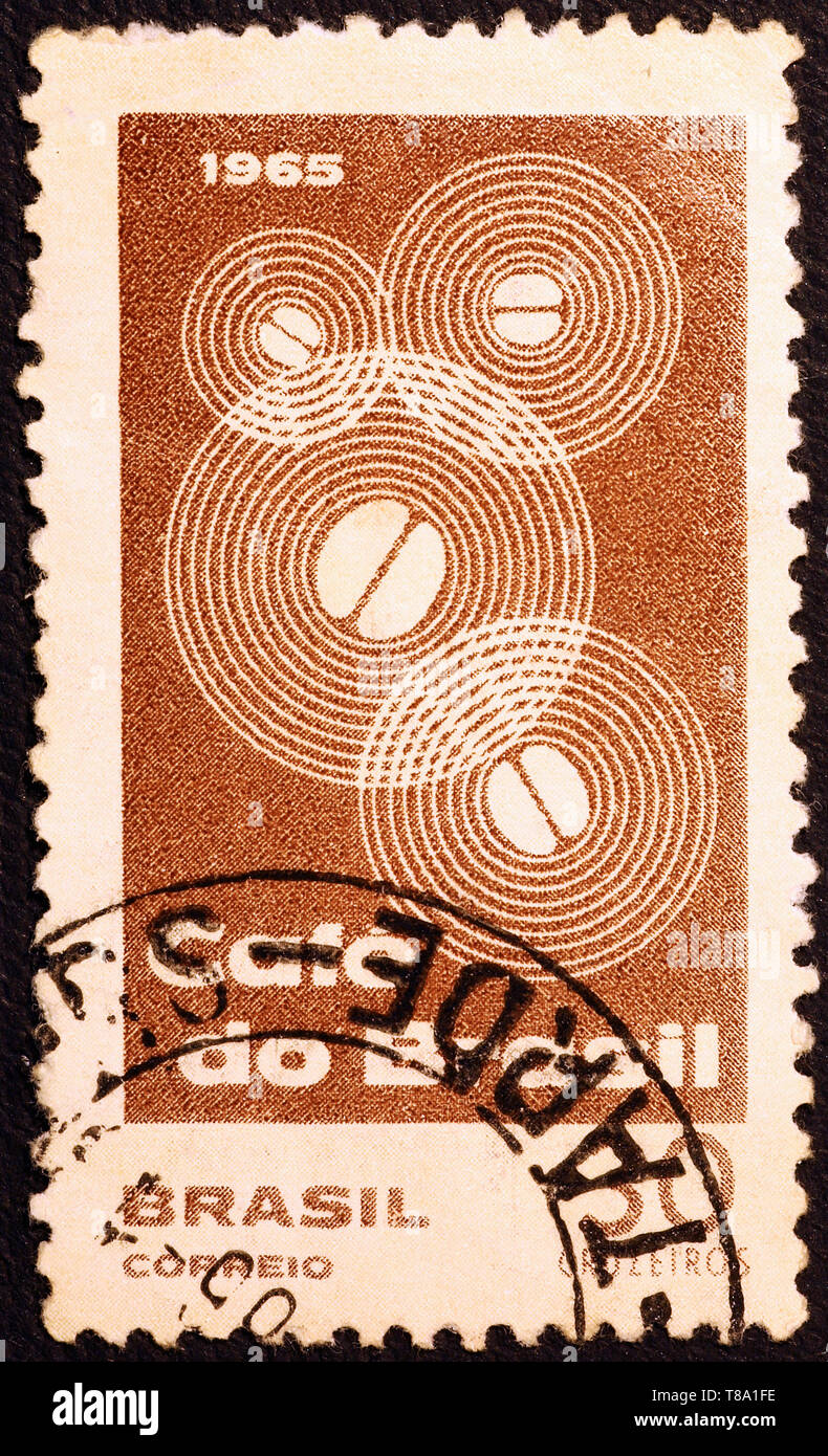 Stylized coffee beans on vintage brazilia postage stamp Stock Photo