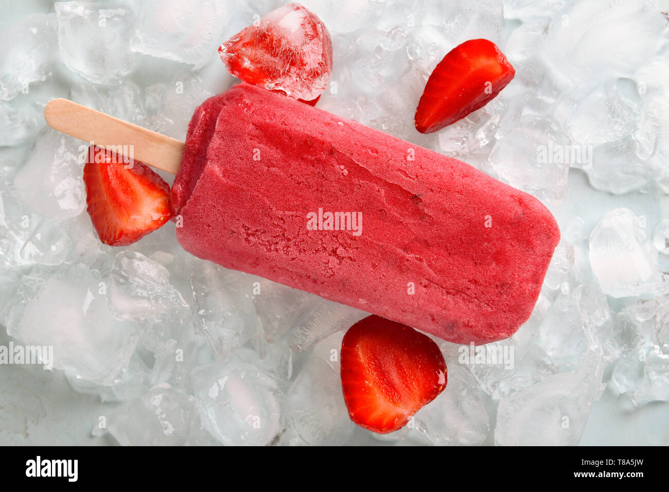 Tasty strawberry popsicle on ice Stock Photo