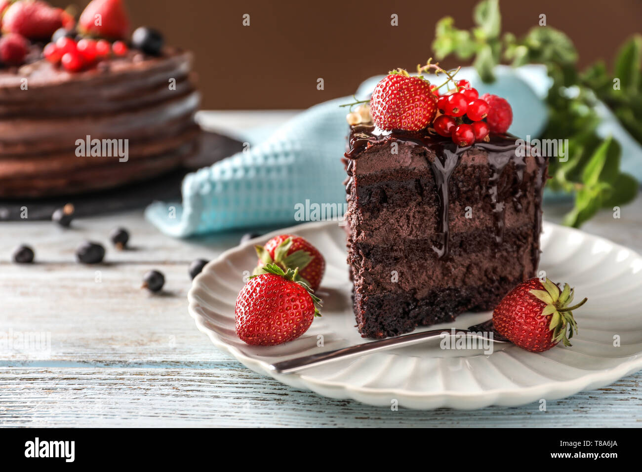 Piece of delicious chocolate cake with berries on plate Stock Photo - Alamy