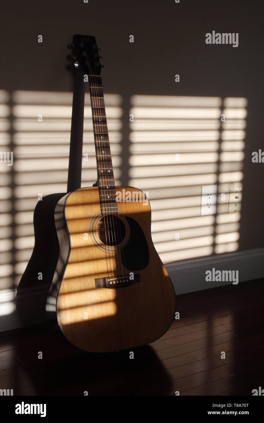 Acoustic Guitar in dramatic lighting Stock Photo Alamy