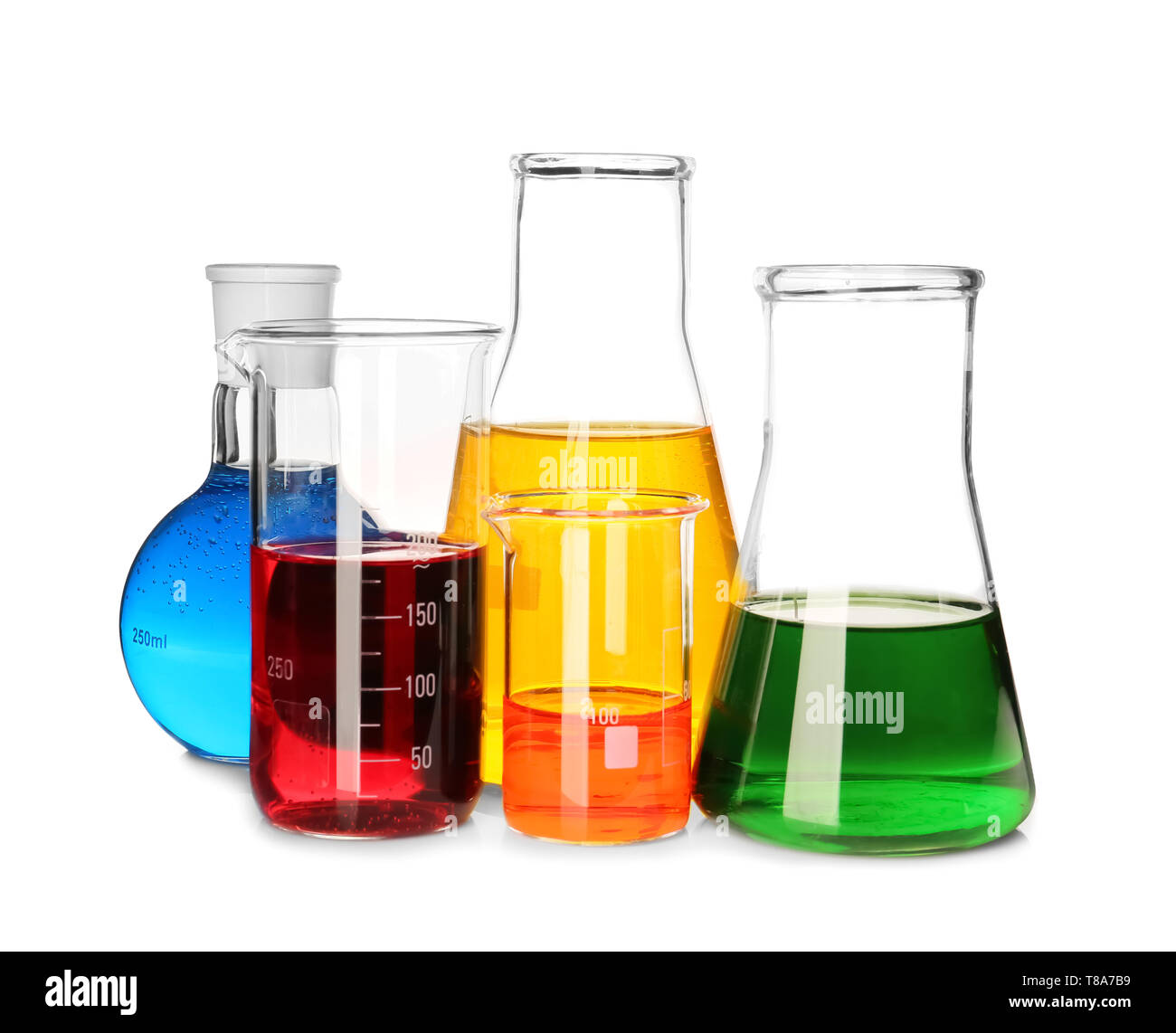 Laboratory glassware with colorful liquids on white background Stock ...
