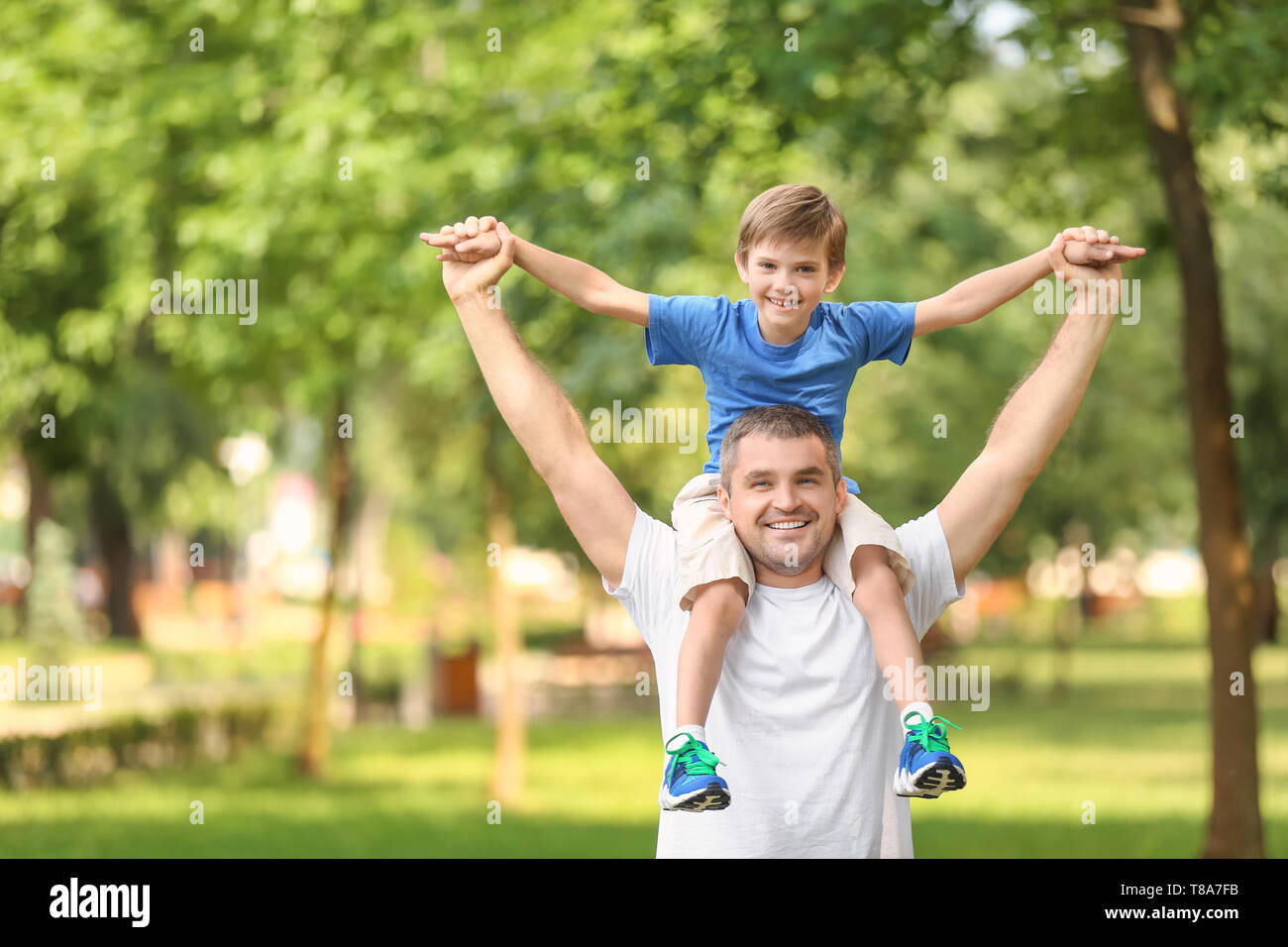 Happy father and son in green park Stock Photo - Alamy