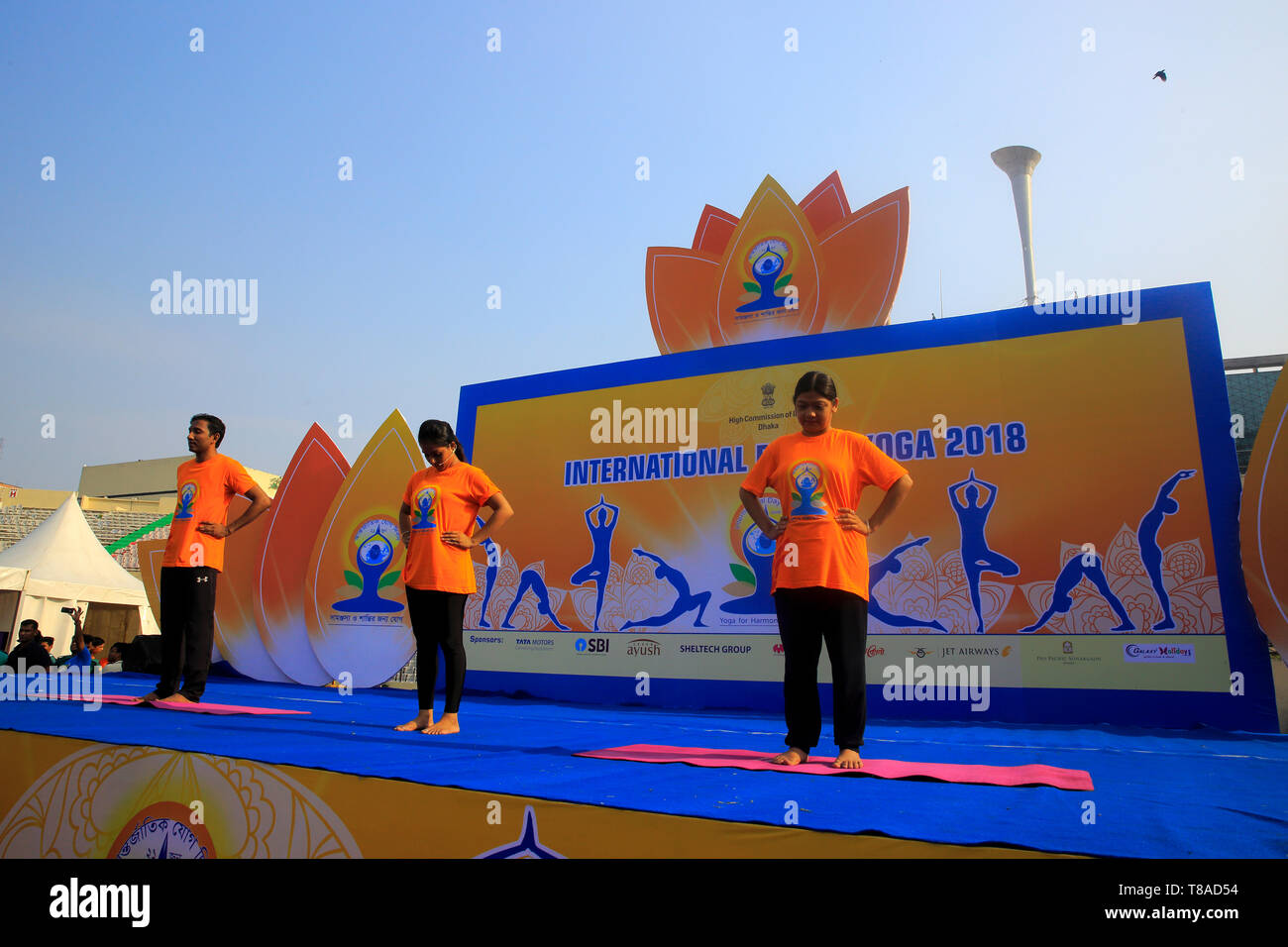 Yoga enthusiasts practice yoga while Indian High Commission in Dhaka