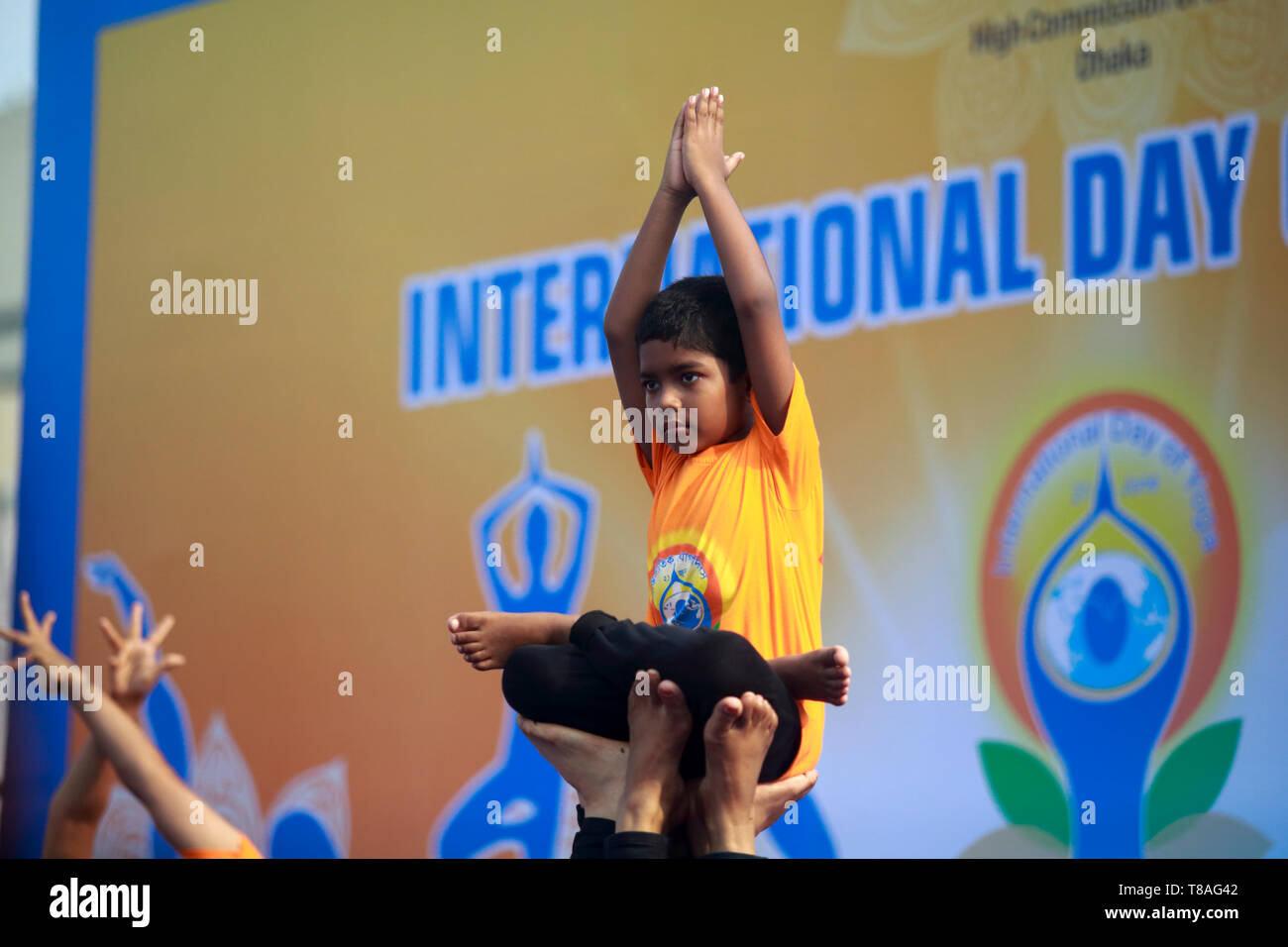 Yoga enthusiasts practice yoga while Indian High Commission in Dhaka