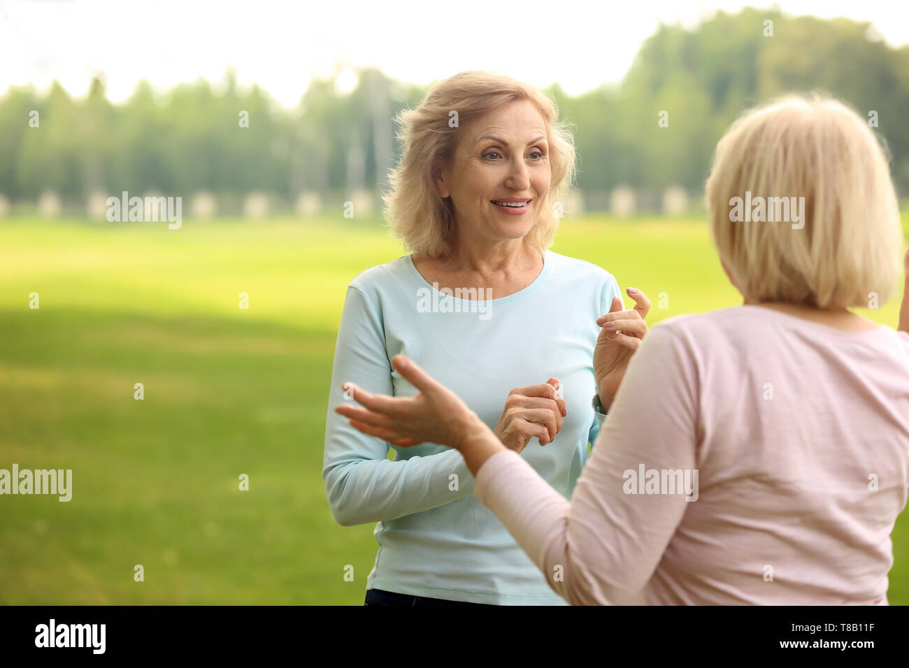 Mature women talking hi-res stock photography and images - Alamy
