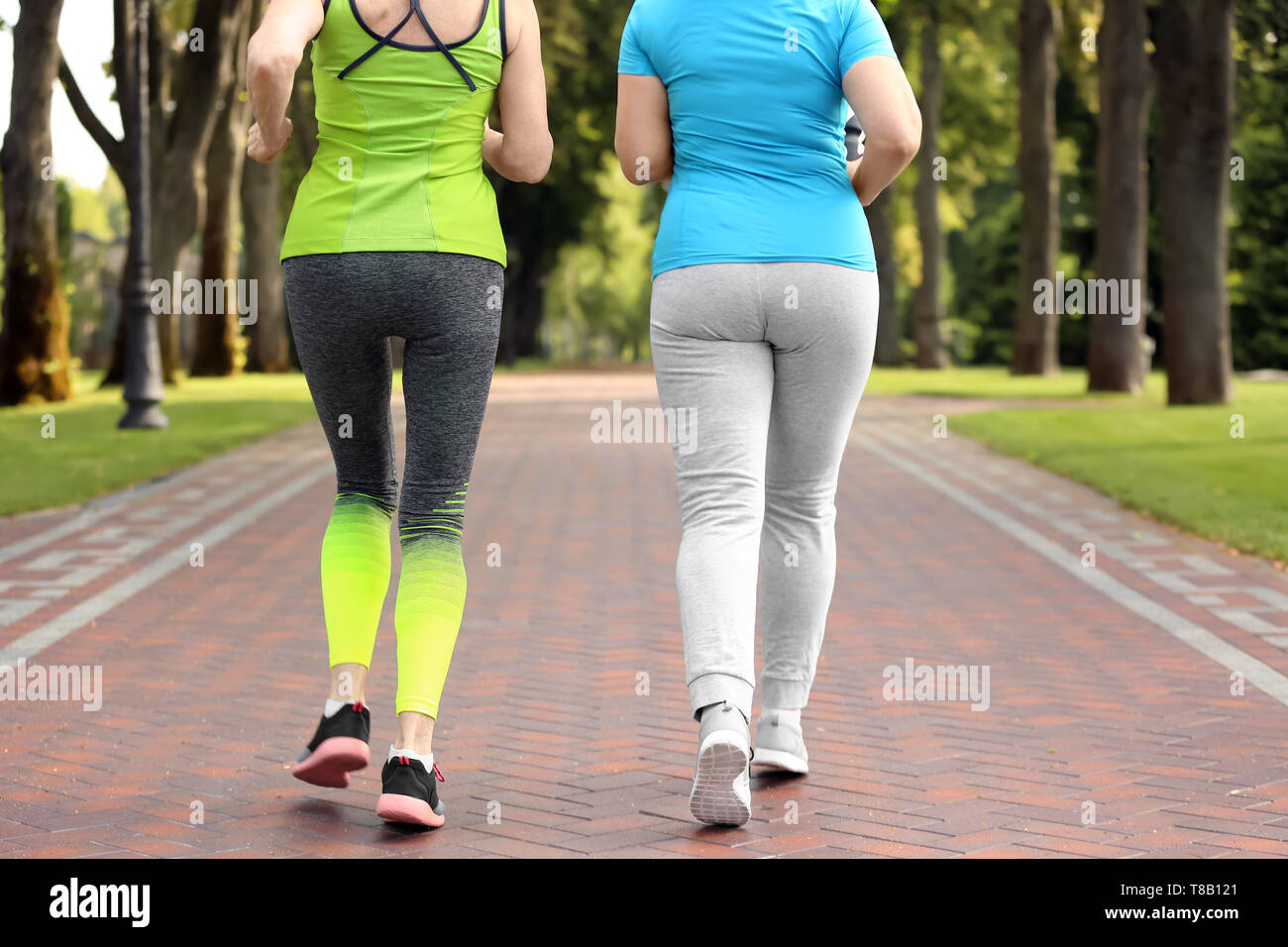 Sporty mature women training in park Stock Photo
