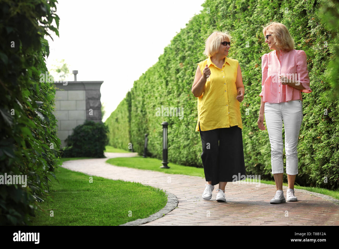 Mature women walking in the park hi-res stock photography and images ...