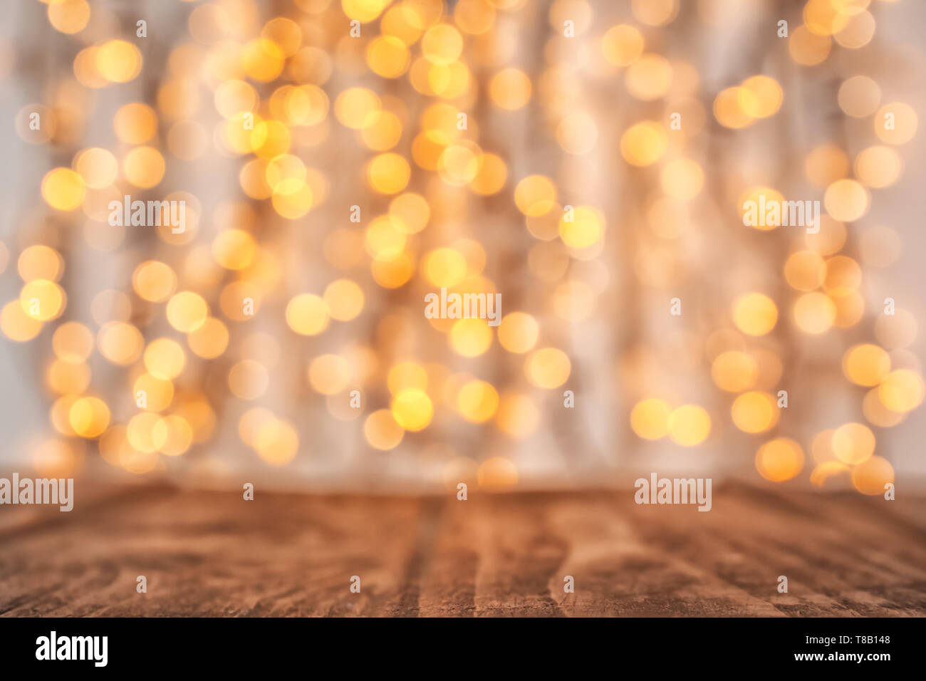 Wooden table and blurred Christmas lights on background Stock Photo - Alamy