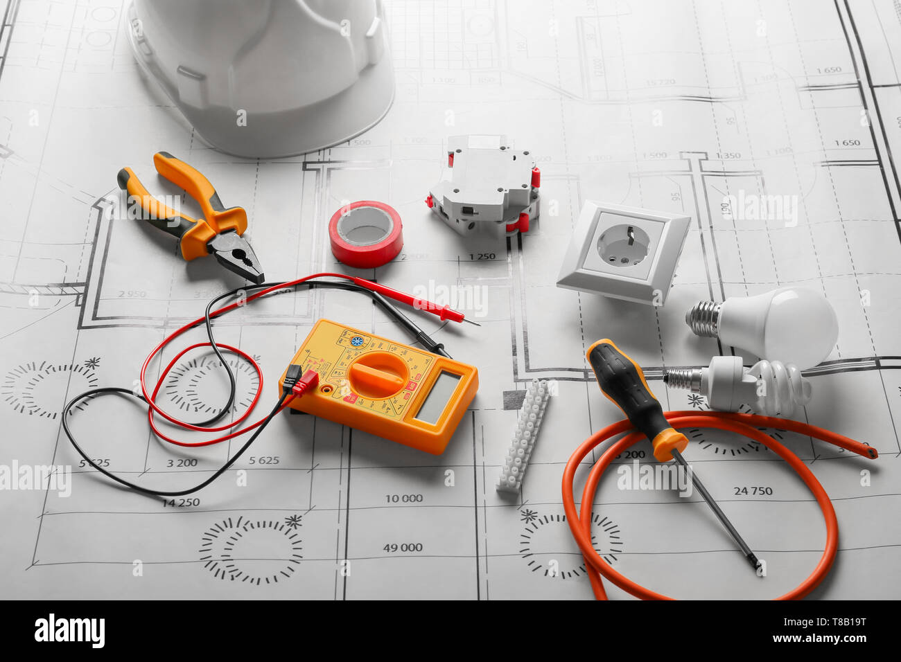 Different electrician's supplies on electrical scheme Stock Photo - Alamy