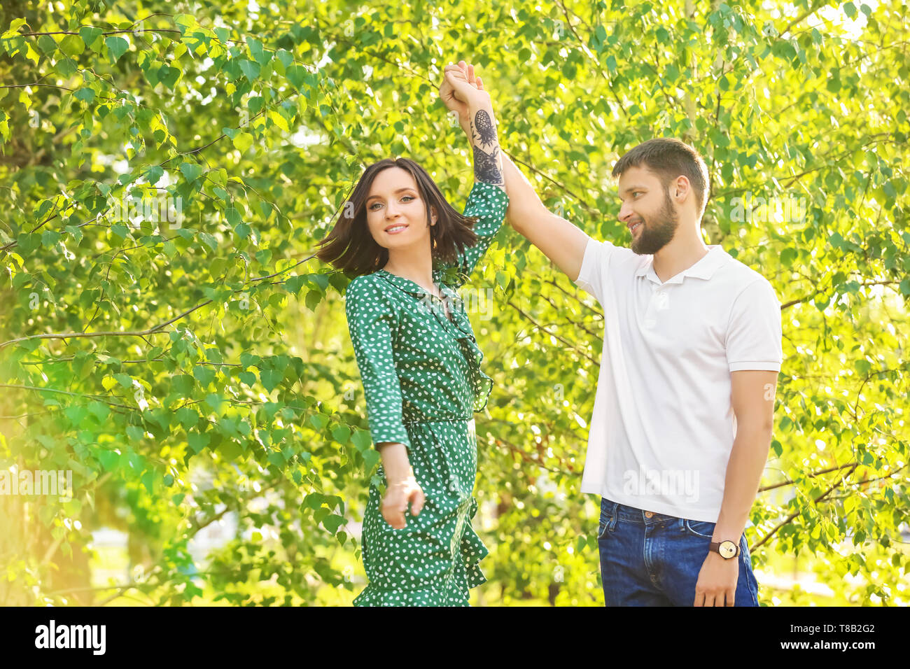 Woman dancing on sunny park hi-res stock photography and images - Alamy