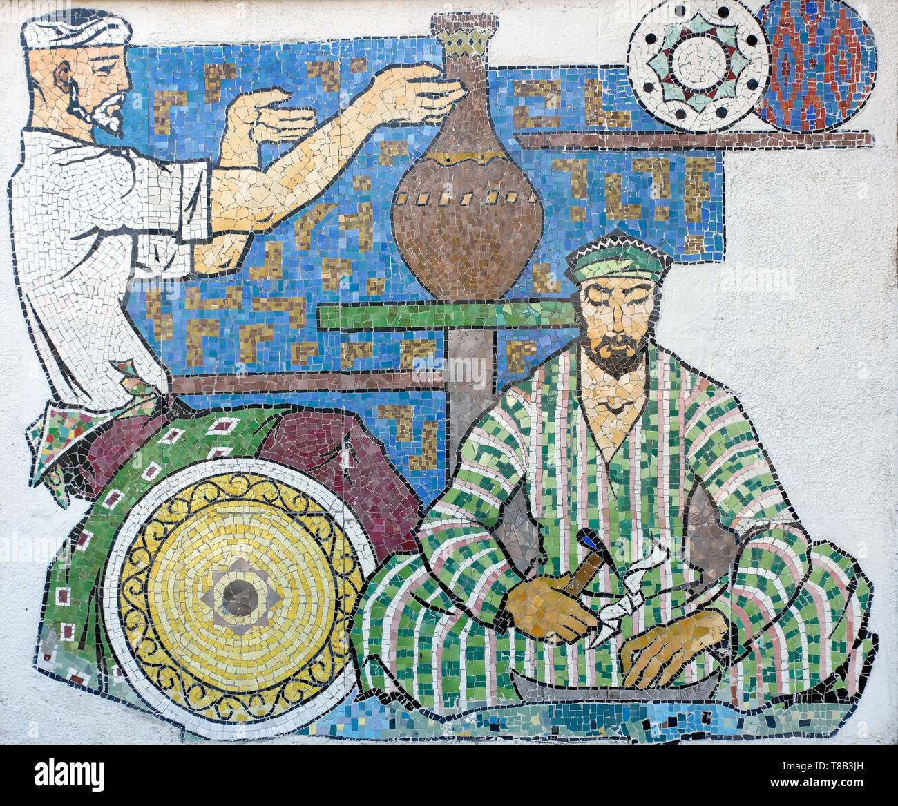 A mosaic depicting Uzbek artisans in the facade of the Museum of Applied Arts situated in the former home of Imperial Russian diplomat Alexander Polovtsev in the city of Tashkent capital of Uzbekistan Stock Photo