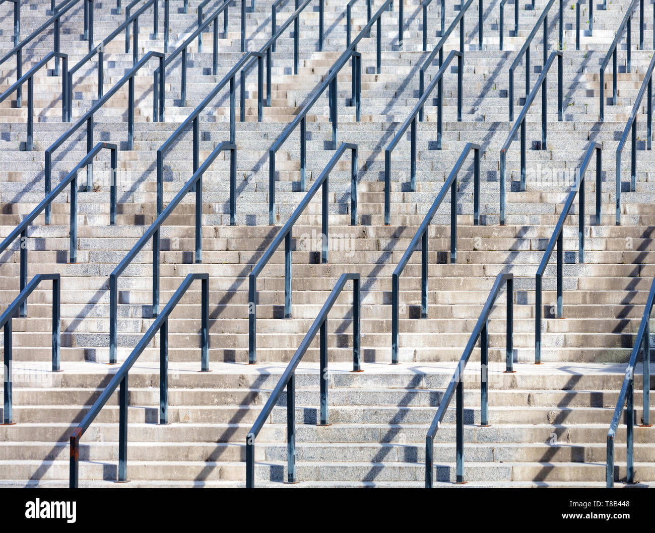 Stone steps and metal rails, the concept of rhythm in photography Stock Photo
