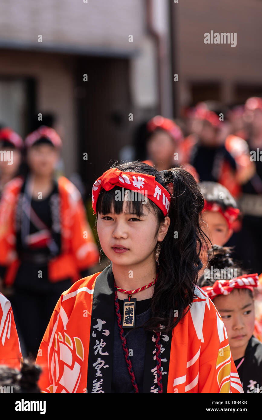Karatsu, Japan - may 5, 2019 : young lady in traditional costumes parade through the street drawning massive floats to celebrate new imperial era "rei Stock Photo
