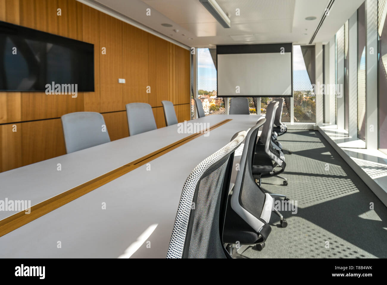 Contemporary office meeting room with a projection screen Stock Photo
