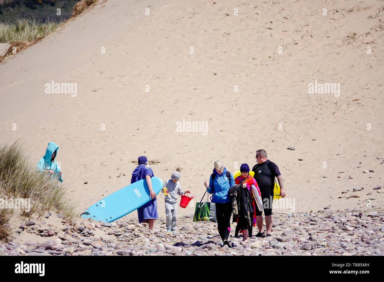 Families enjoy the sunshine at Llangennith beach, Gower peninsula, swansea, UK Stock Photo