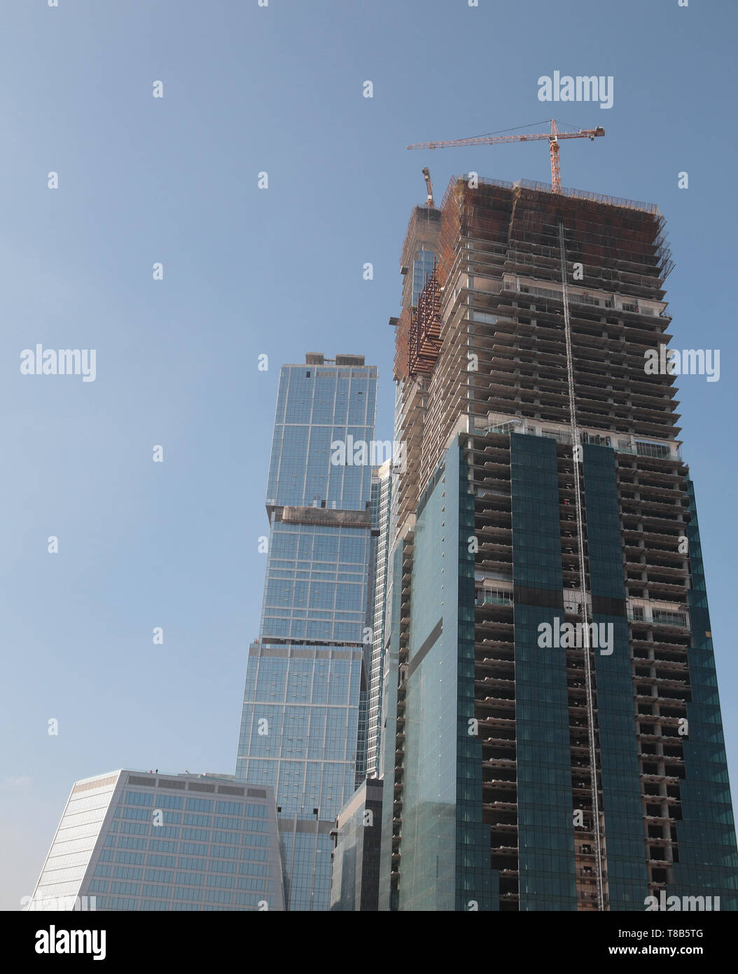 skyscraper develop on sky background Stock Photo - Alamy
