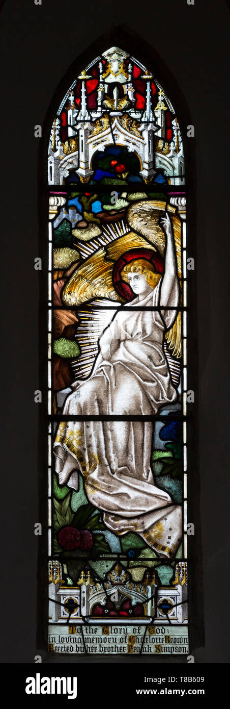 Stained glass window angel in heaven by Henry James Salisbury (1864-1916), Bishops Cannings church, Wiltshire, England, UK Stock Photo