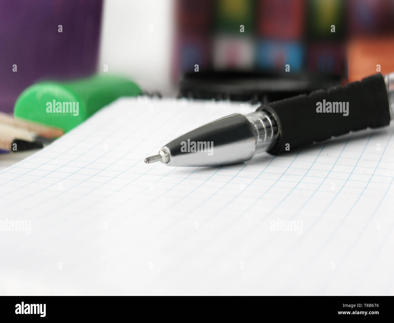 close up.ballpoint pen Notepad on blurred background. Stock Photo