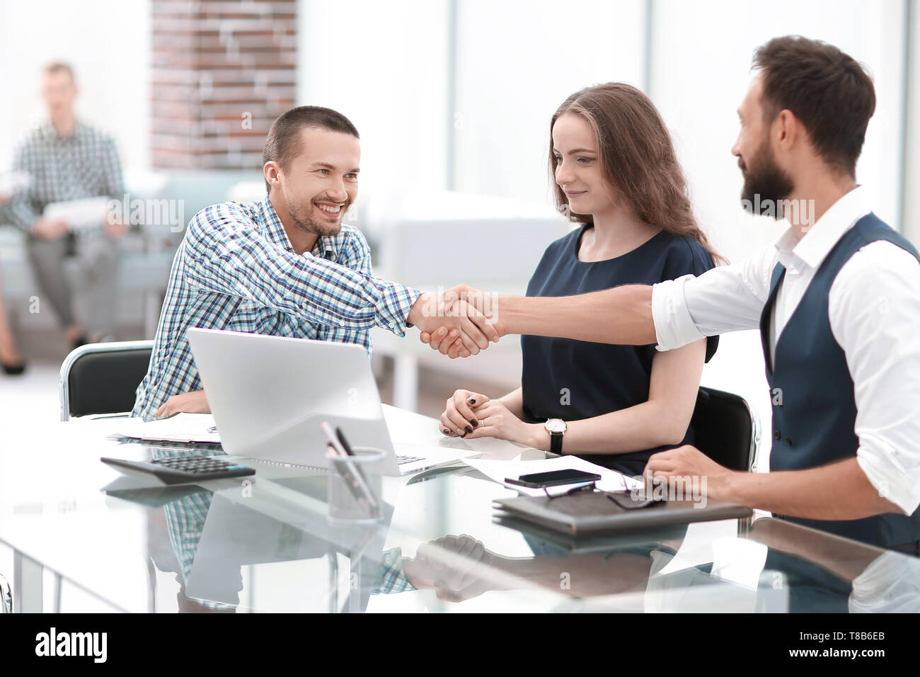 handshake business people sitting at the office Desk.concept of ...