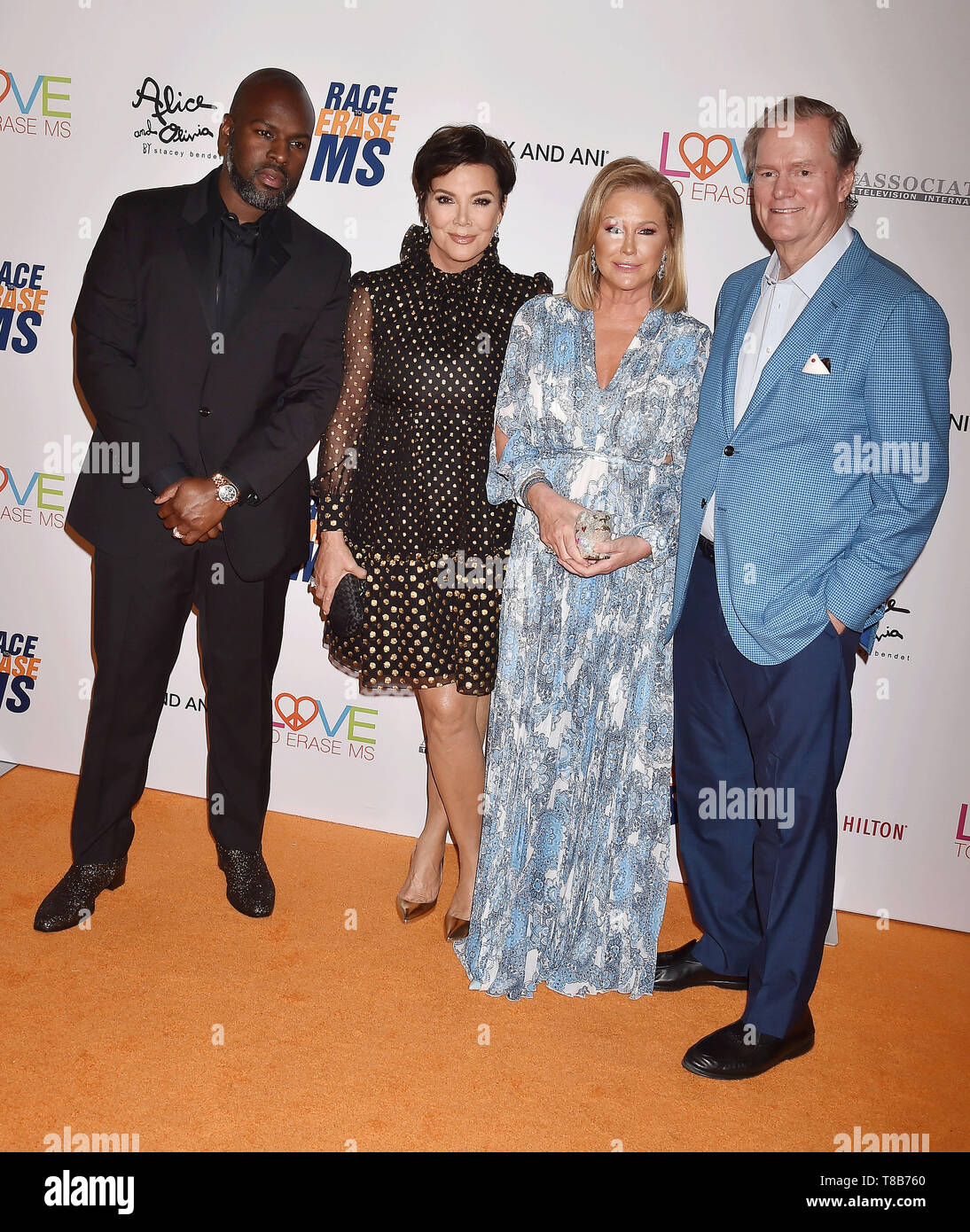 BEVERLY HILLS, CA - MAY 10: (L-R) Corey Gamble, Kris Jenner, Kathy Hilton and Rick Hilton attend the 26th Annual Race to Erase MS Gala at The Beverly Hilton Hotel on May 10, 2019 in Beverly Hills, California. Stock Photo