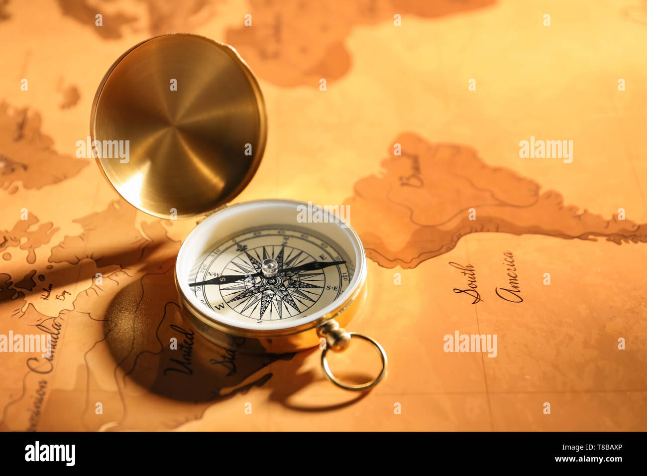 Vintage compass on world map Stock Photo - Alamy