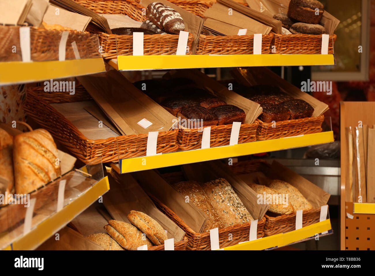 Assorted fresh tasty bread in shop Stock Photo