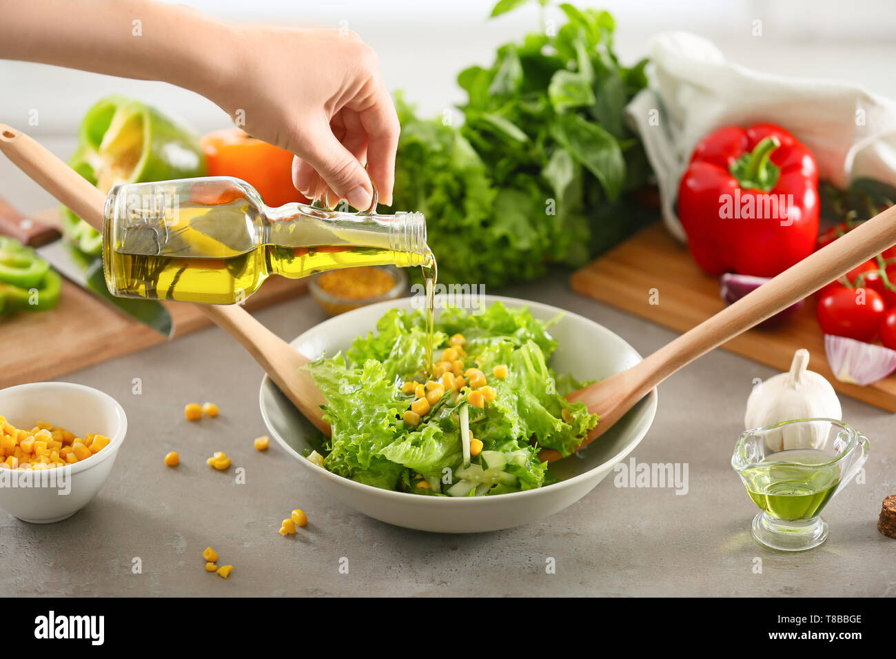 Adding Fresh Oil Hand adding fresh ingredients glass hi-res stock photography and images ...