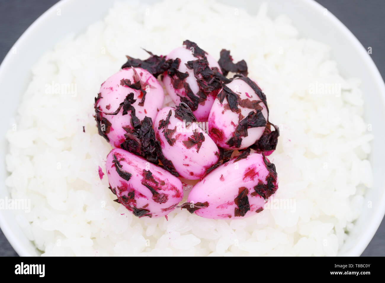 Japanese cooked white rice with shiso pickled garlic on a bowl Stock