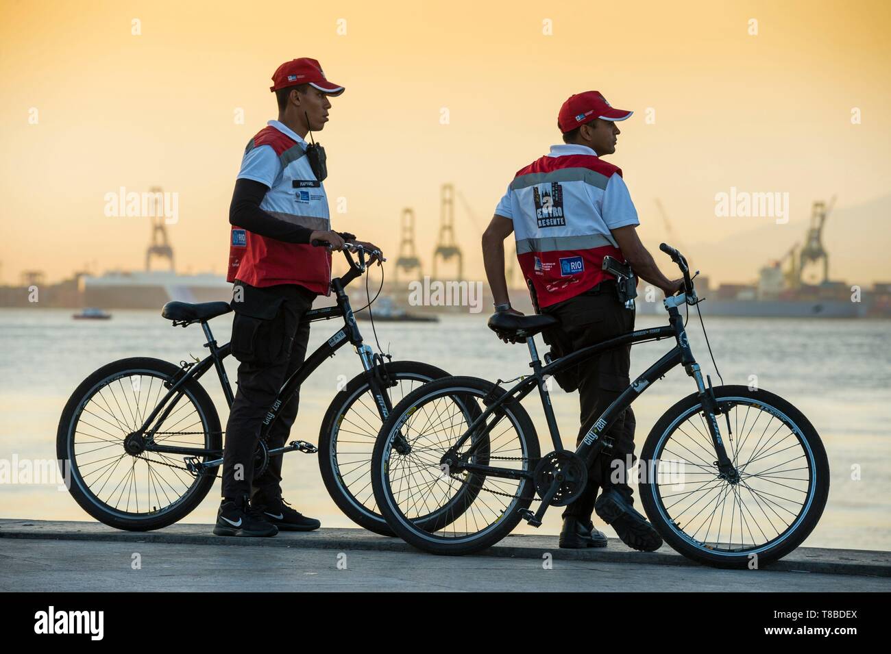 Brazil, Southeast region, Rio de Janeiro, city classified World Heritage of UNESCO, city center (Centro), view of the Atlantic ocean from Maua square, in front of the Museum of Tomorrow (Museo do Amanha) designed by architect Santiago Calatrava, two policemen on bicycle Stock Photo