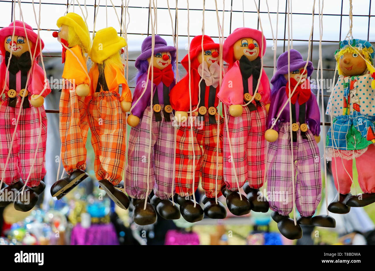 handmade clown puppets on sale at a local festival Stock Photo