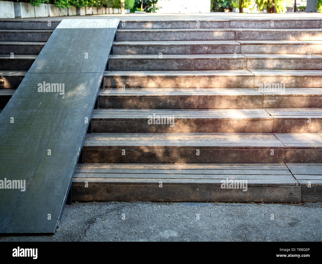 Plank wood stair outdoor with wooden wheelchair ramp. Old wooden stair