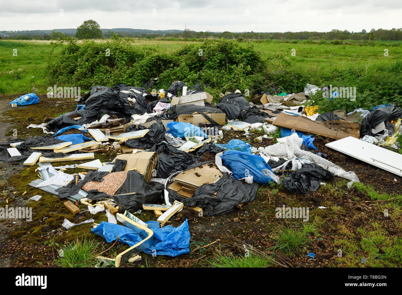 Fly tipping rubbish and waste in countryside on the outskirts of Birmingham UK Stock Photo