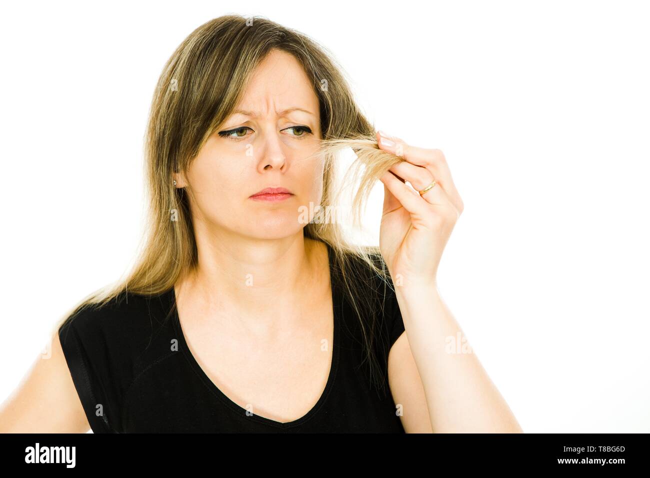 Blond Woman Housewife Seeing Problem With Long Straight Hairs