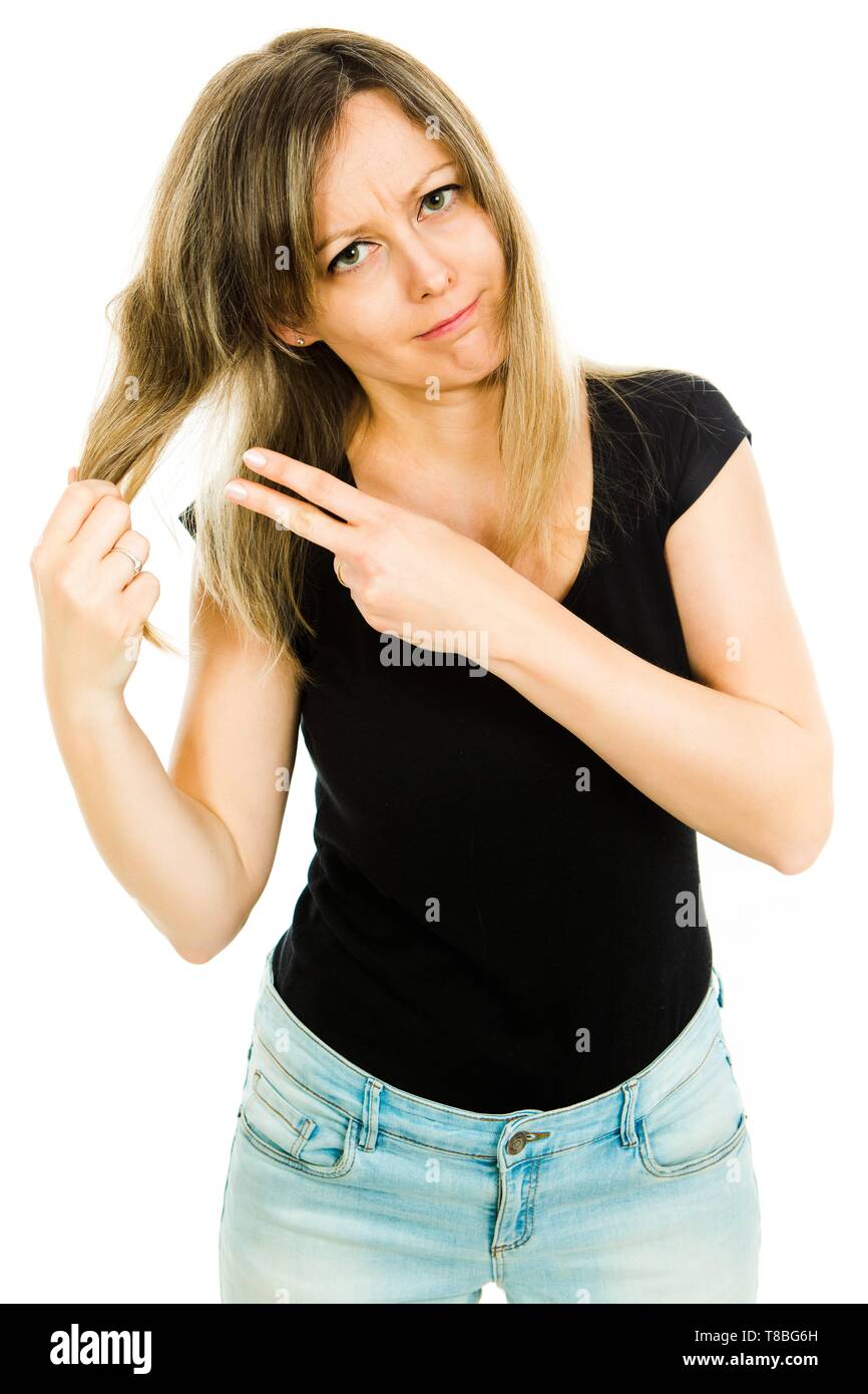 Blond woman shoving gesture of hair cut and hair stylist needed - problem with long straight hairs - gesture of hair cut needed - white background Stock Photo