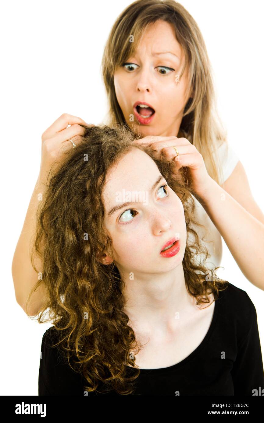 Mother Checking Child S Head For Lice Showing Emotion Of Surprise